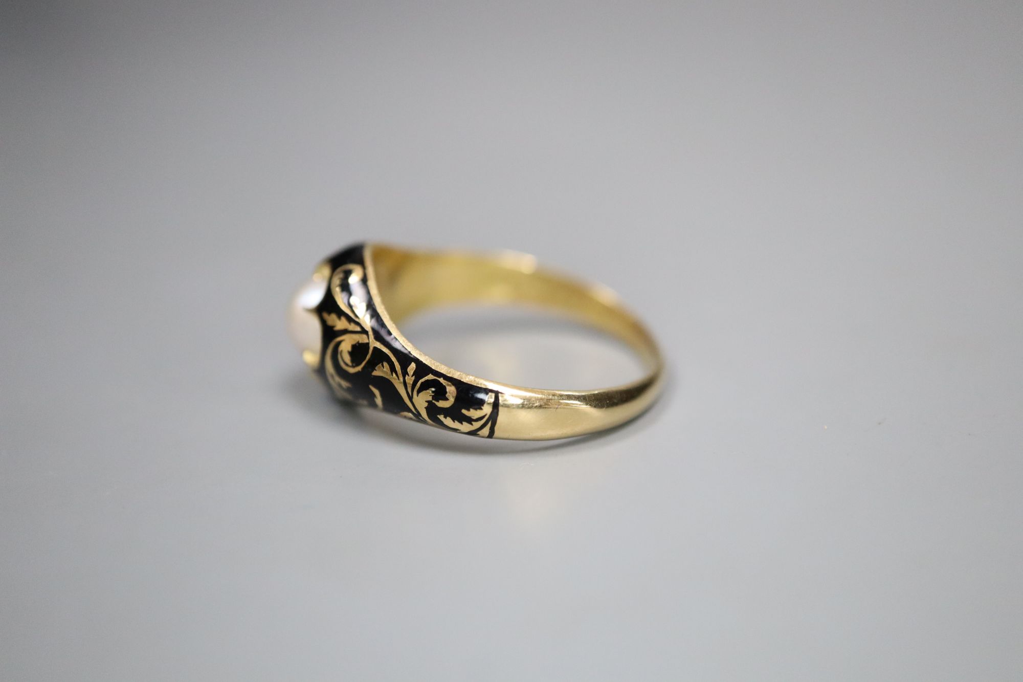 A Victorian 18ct gold, black enamel and pearl memorial ring, gross 3.7 grams, size Q.